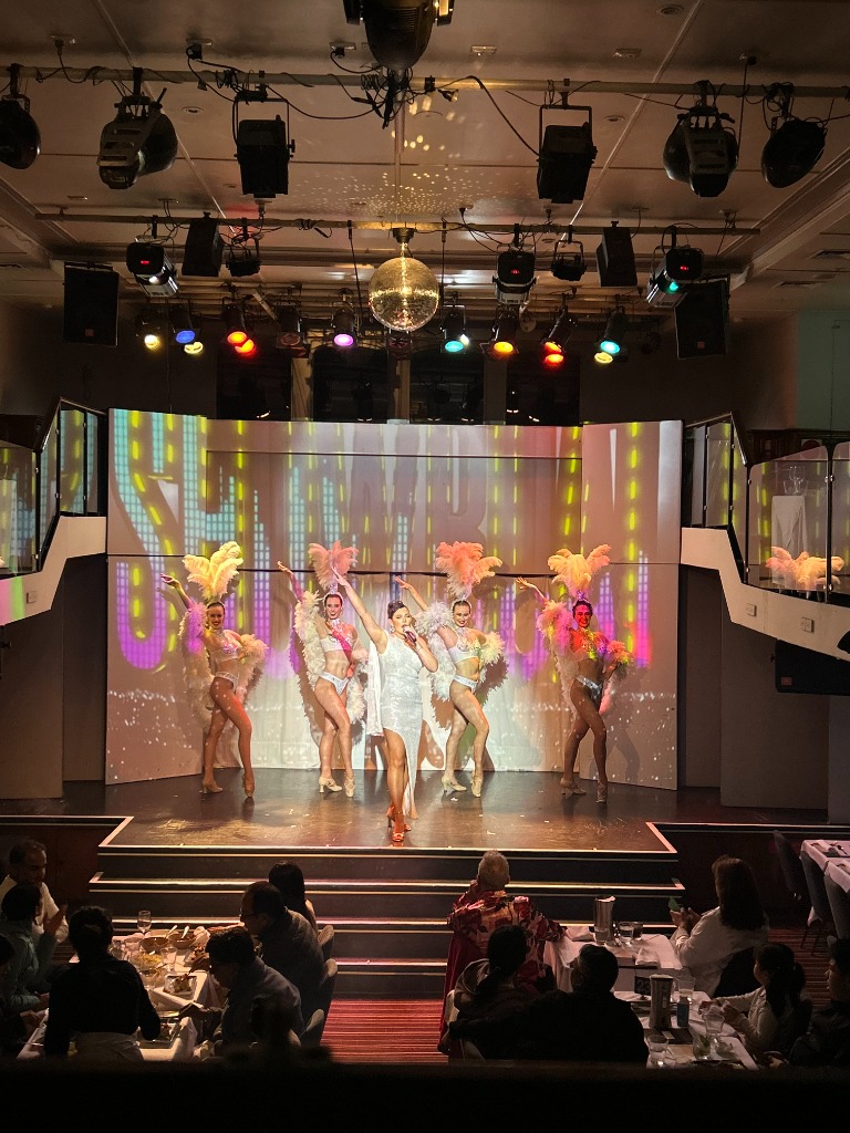 Lana Domeney and Showboat Follies dancers live on stage in Sydney